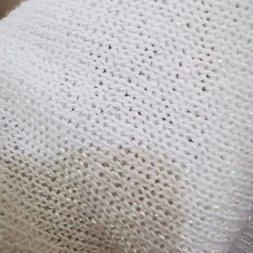 White Paranoia knitted top like new with one shoulder and glitter
