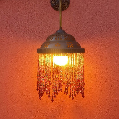 Wall light with beaded fringe