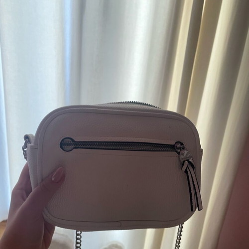 White crossbody bag with silver shoulder chain