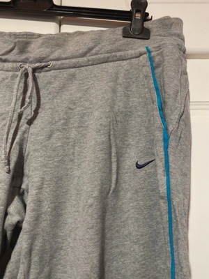 Nike grey joggers with blue line and black logo, size M, used