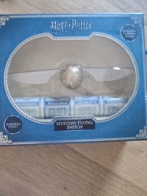 Harry Potter mystery flying snitch used with bonus quidditch poster