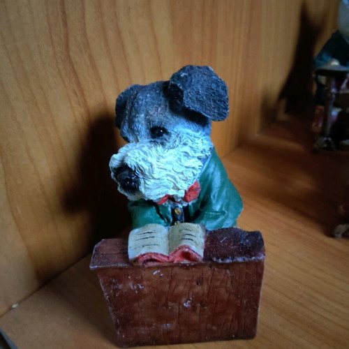 Decorative dog figure with piano like new