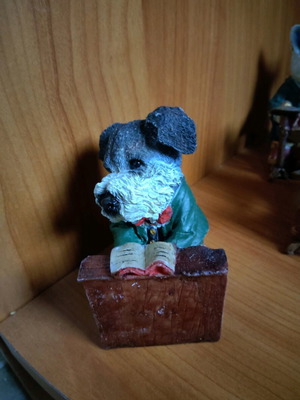 Decorative dog figure with piano like new