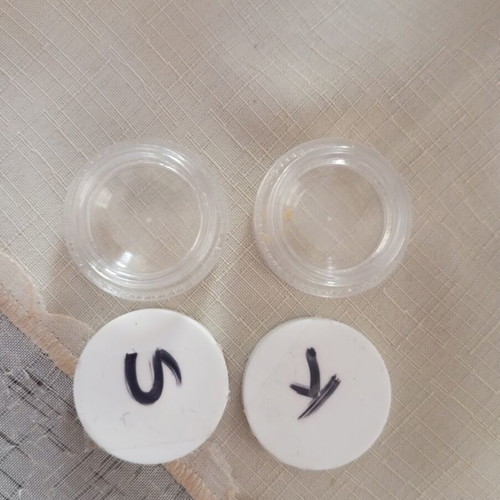 Small cream containers used, set of two