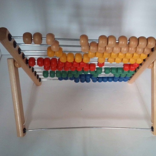 Wooden children's abacus counting frame used