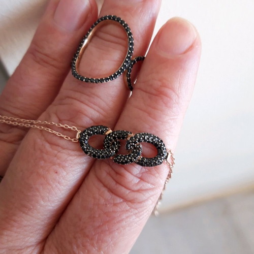 Silver set used with ring and black bracelet