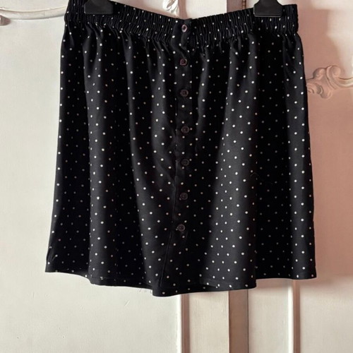 Pink Woman polka dot skirt with buttons, black and white