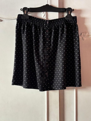Pink Woman polka dot skirt with buttons, black and white