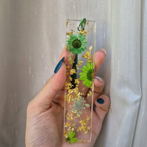 Handmade bookmark with green dried flowers in resin