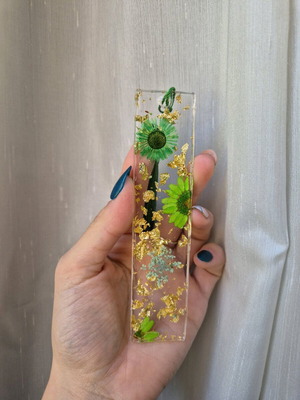 Handmade bookmark with green dried flowers in resin