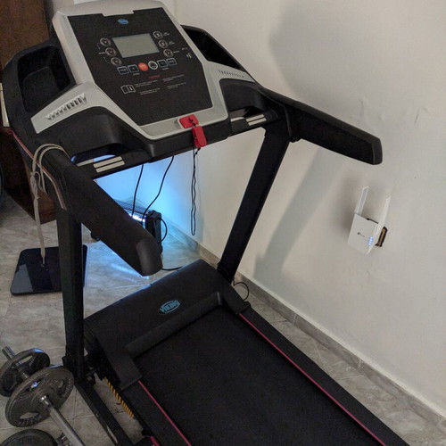 Viking treadmill with suspension and automatic lubricant dispenser