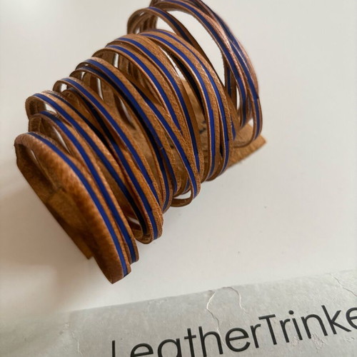 Leather bracelet used brown with blue details
