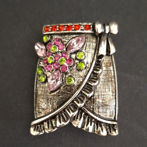 Vintage skirt-shaped brooch in silver metal with colorful rhinestones like new