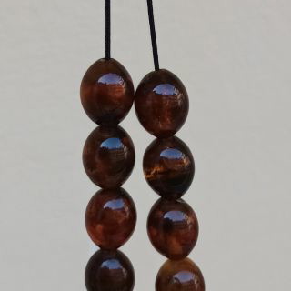 Pressed olive amber worry beads used, 38 g, 21 beads