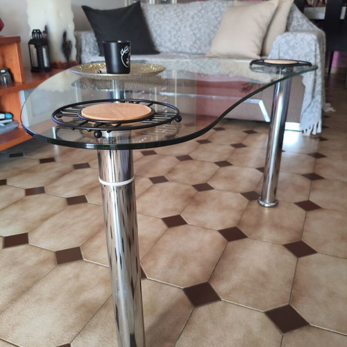 Glass coffee table with metal legs
