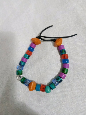 Bracelet like new with leatherette strip and beads