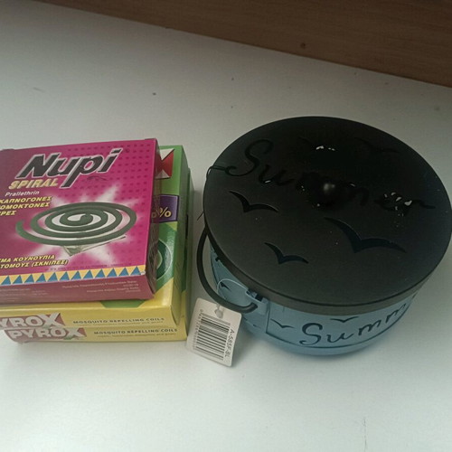 Insect repellent container like new, pack with coils