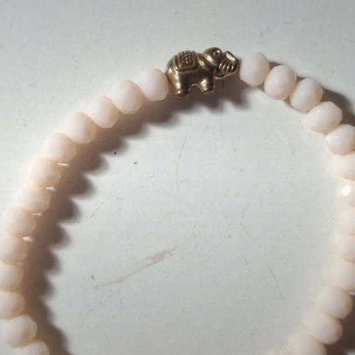 Elephant bracelet like new, cream elastic beads