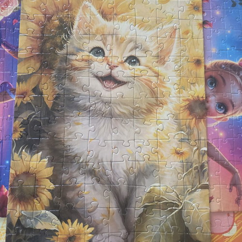Completed puzzle with kitten and sunflowers