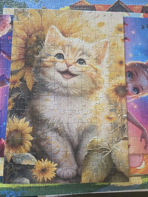 Completed puzzle with kitten and sunflowers