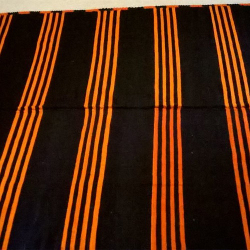 Woven blanket used orange and blue in two joined pieces