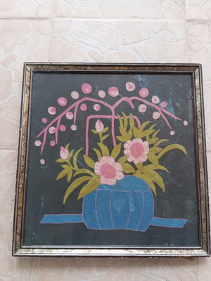 Vintage embroidered handmade frame with thread used