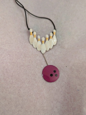 Bowling necklace like new, silver and enamel
