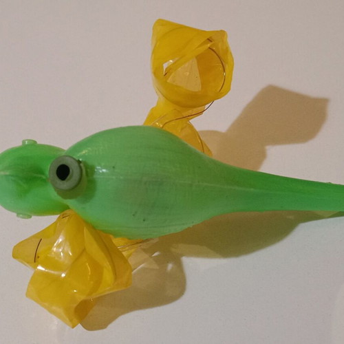 Plastic bird-shaped whistle used, green color