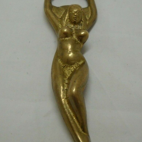 Vintage solid brass bottle opener shaped like a woman used