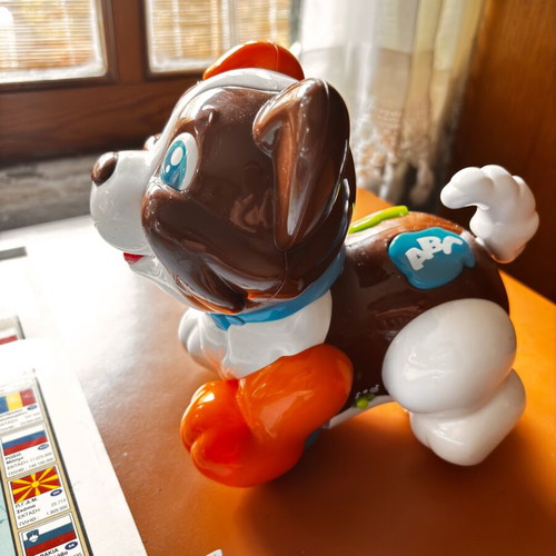 Colorful puppy toy on wheels designed by Clementini