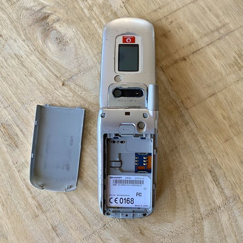 Sharp GX30 vintage clamshell phone used, iconic Vodafone Live! model
