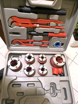 Plumbing tool set new with wrench, pliers and pipe dies
