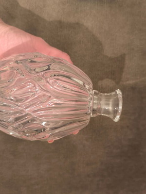 Decorative carved glass bottle like new