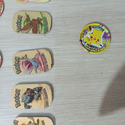 Pokemon Tazos pack of 47 and 5 gold plates like new
