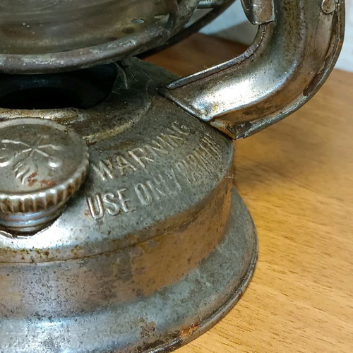 Vintage storm lantern used with cracked glass