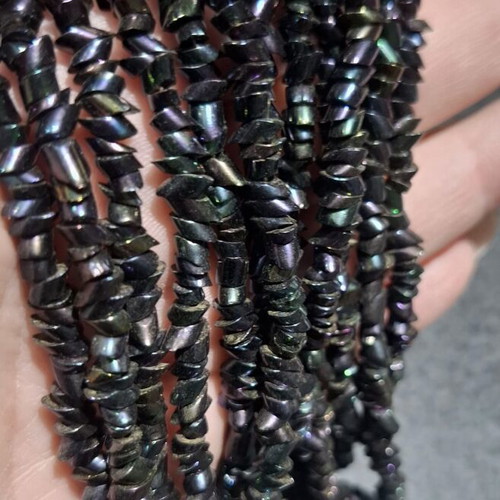 Torsade necklace used with iridescent carnival glass beads, 50cm