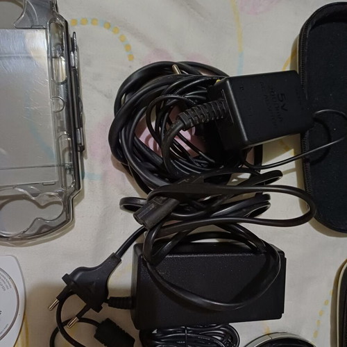 Sony PSP handheld consoles with accessories and games