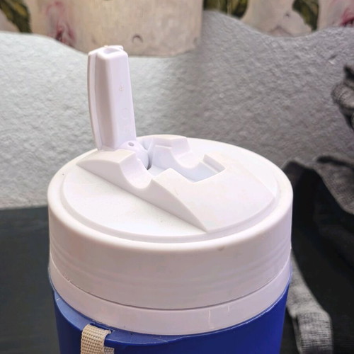 Plastic water jug like new, blue and white with straw