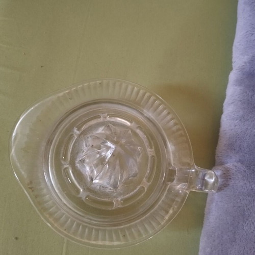 Glass lemon squeezer used