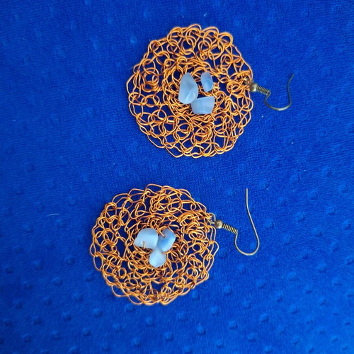 Handmade knitted copper earrings with blue glass stones