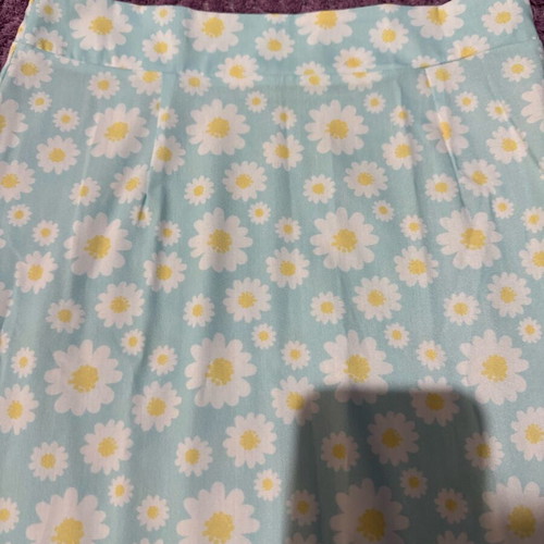 Mini skirt with daisies on blue background, size S, like new