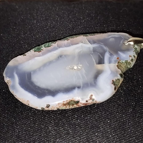 Stone pendant used with polished natural stone slice