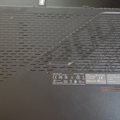 ASUS ROG Strix G531GT gaming laptop with headphones and keyboard