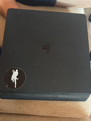 PlayStation 4 Slim 1TB console with original controller