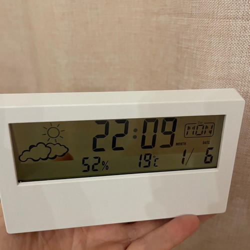 Clock with date and temperature display like new