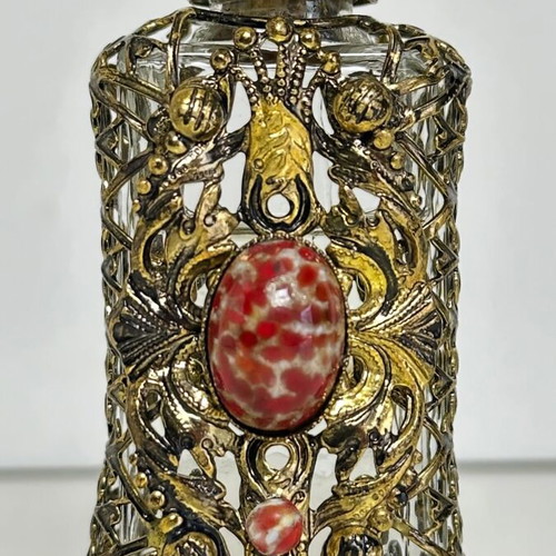 Vintage perfume flacon with filigree metalwork and red cabochon