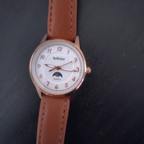 Quartz women's watch new, brown