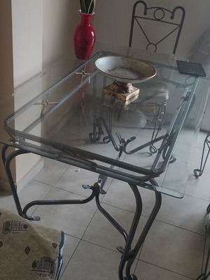 Outdoor table with glass and 6 used chairs set