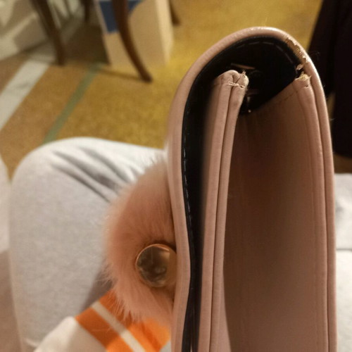Pink clutch used with chain and slight wear