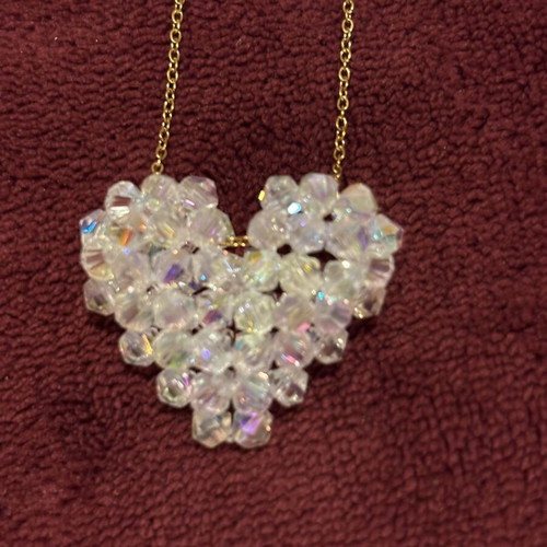 Gold necklace with crystal heart pendant